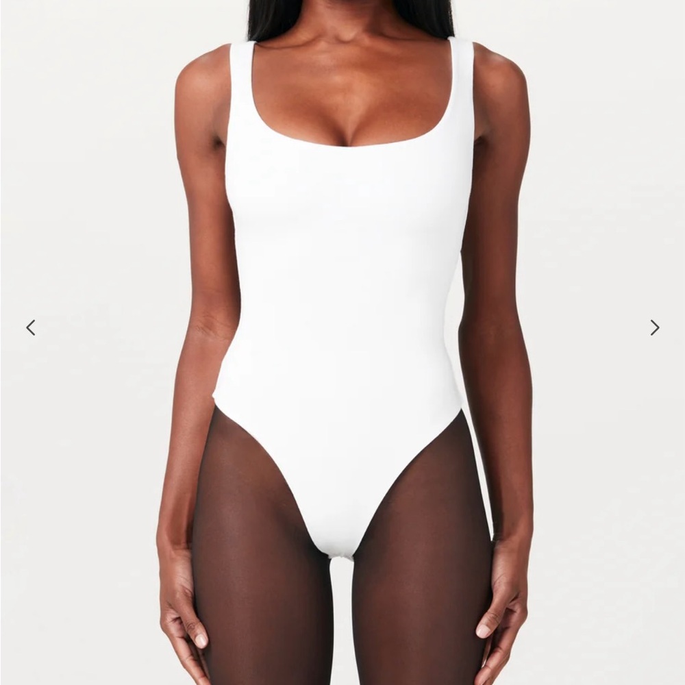 White Scoop Bodysuit by Naked Wardrobe